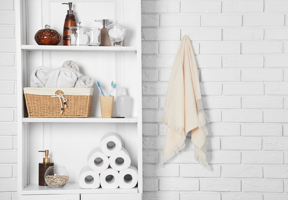 open shelves in white bathroom