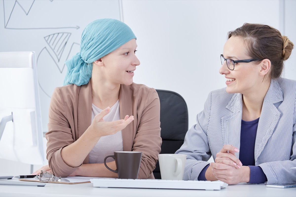 Woman with cancer talking with another woman