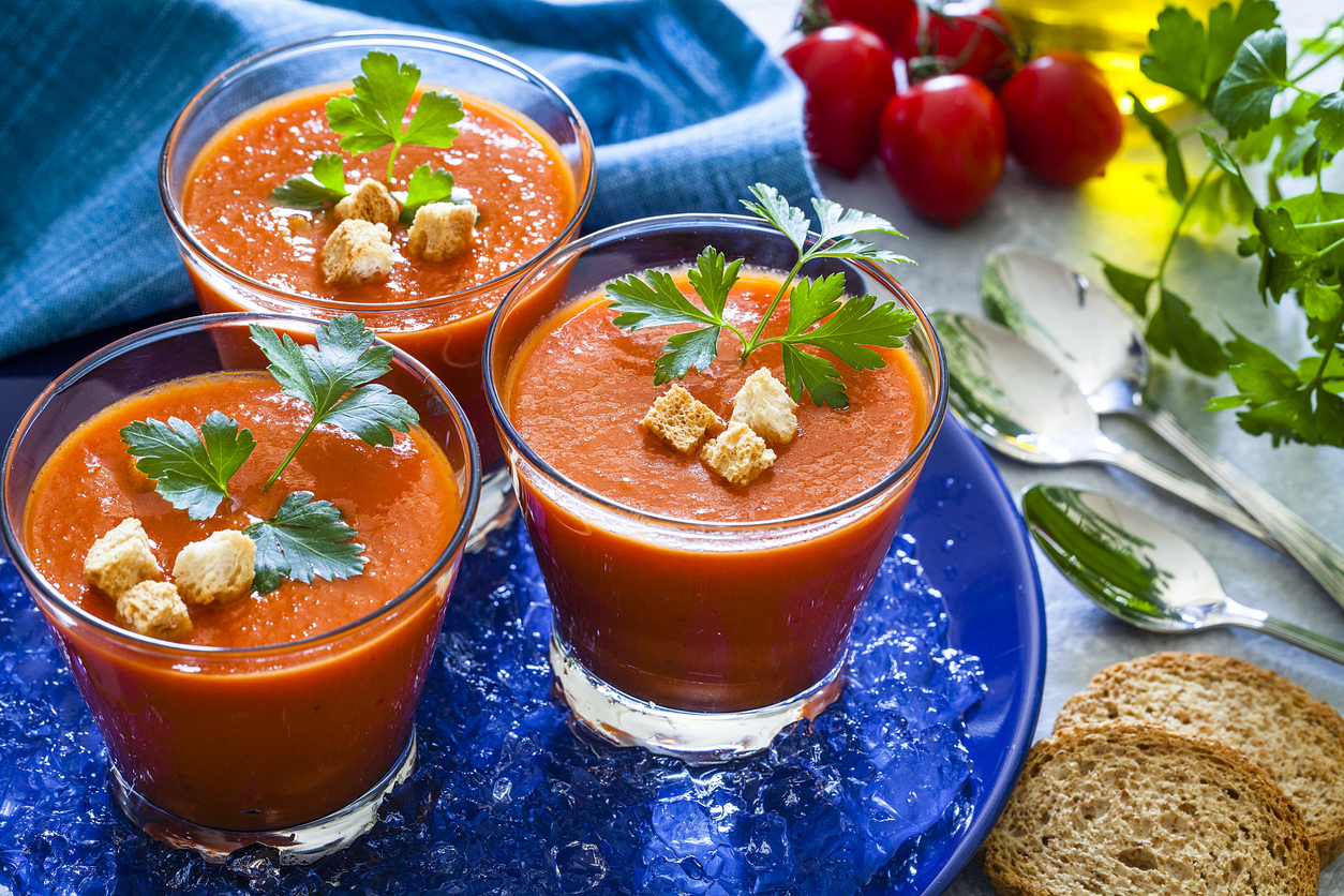 Three Spanish gazpacho in drinking glasses