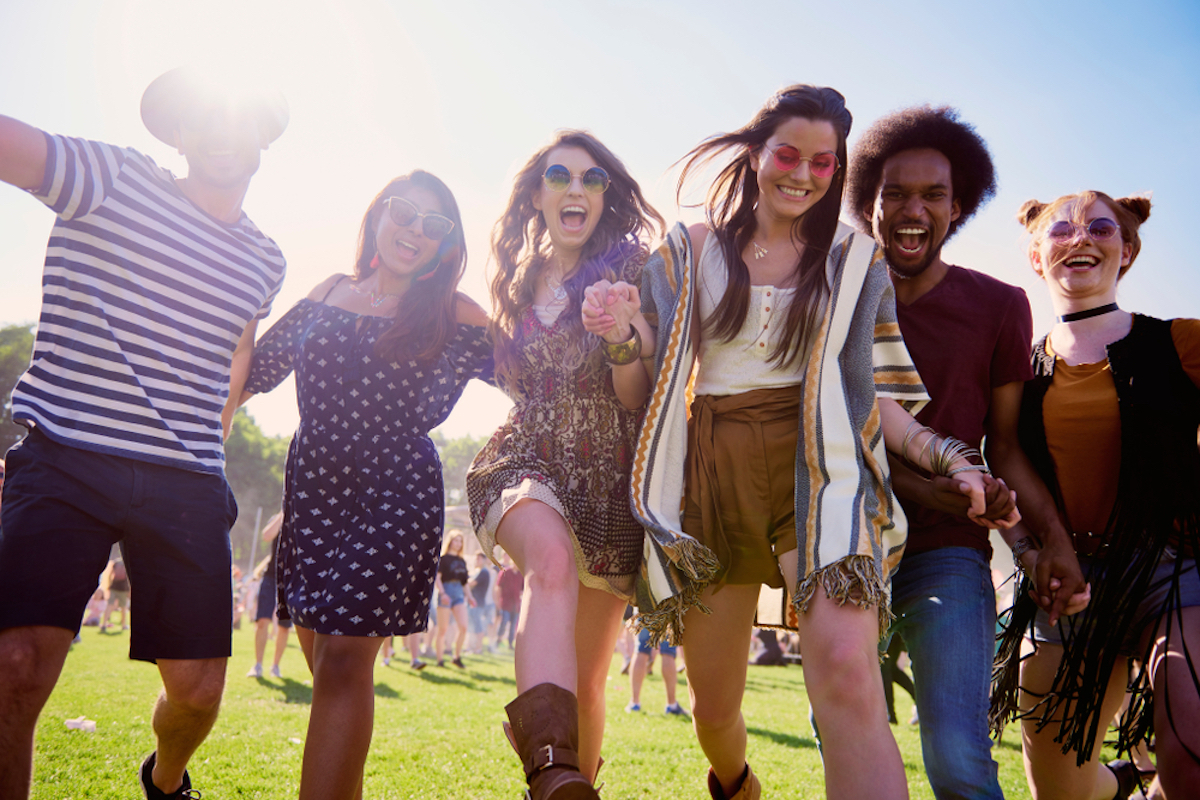 group of friends attend a festival like coachella