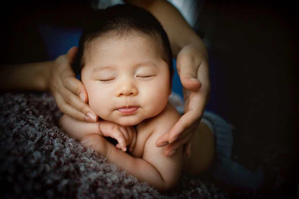 mom touching baby