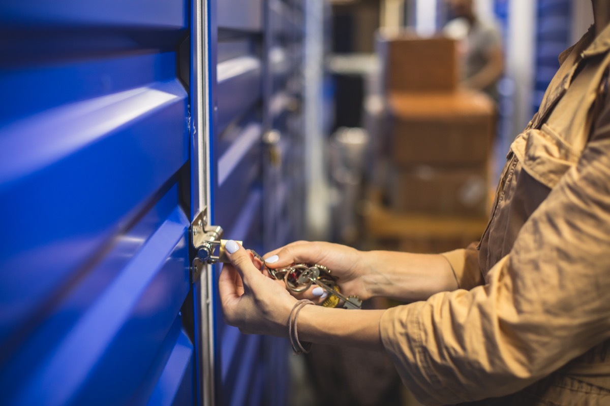 View of self storage warehouse, process of keeping and storing the goods and items in a storage units, self-storage building, lock and key concept