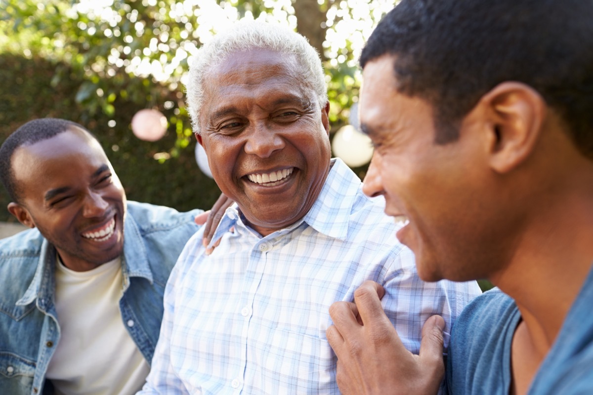 father laughing with his sons, smart person habits