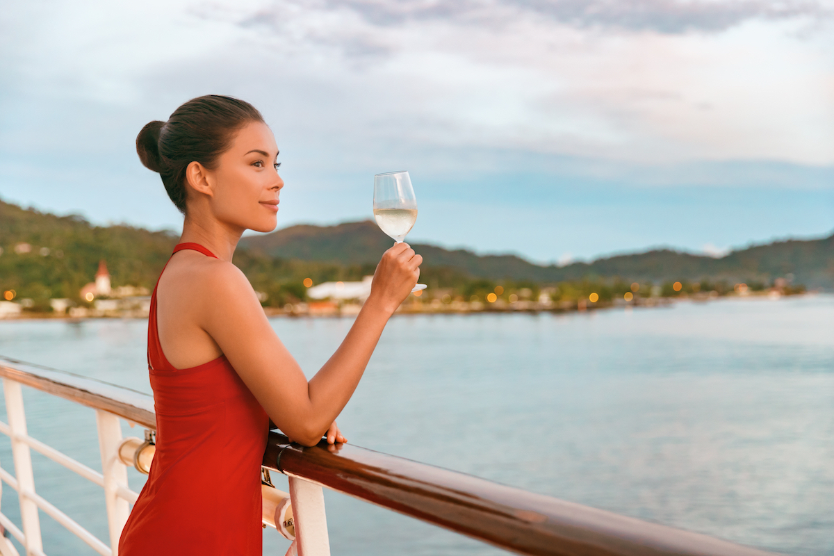 woman drinking champagne on a cruise