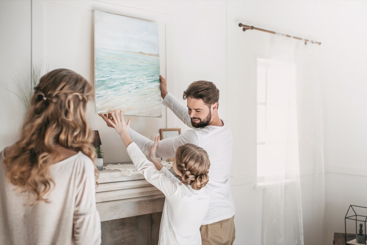 Family hanging picture of beach