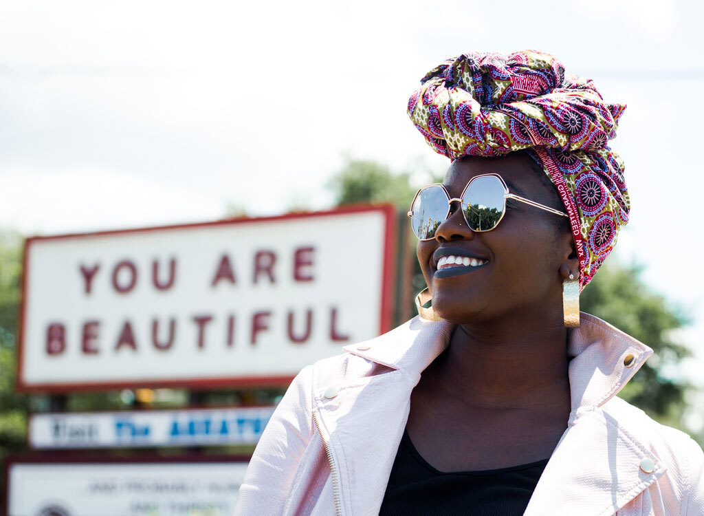 Woman smiling with sign you are beautiful