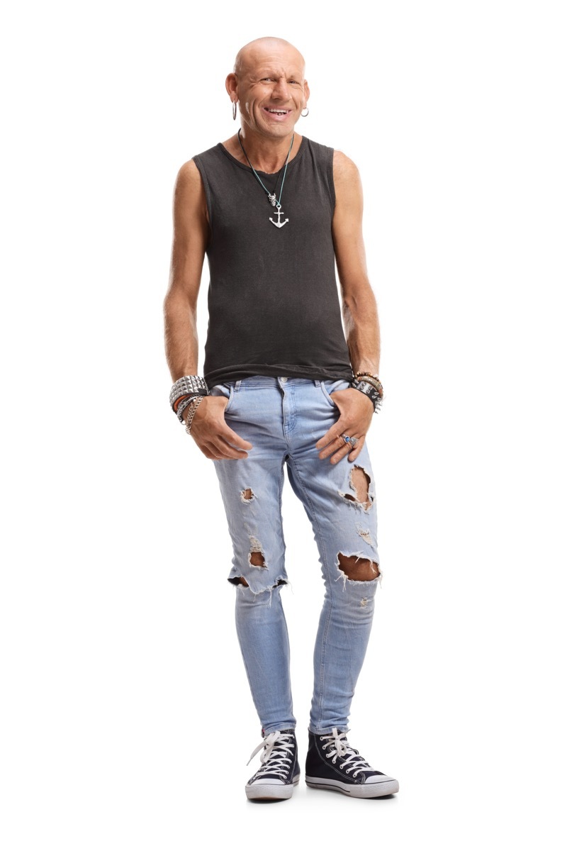 Older man in punk outfit ripped jeans