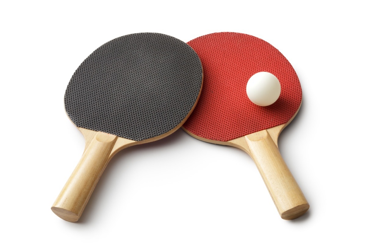 ping pong paddles on white background