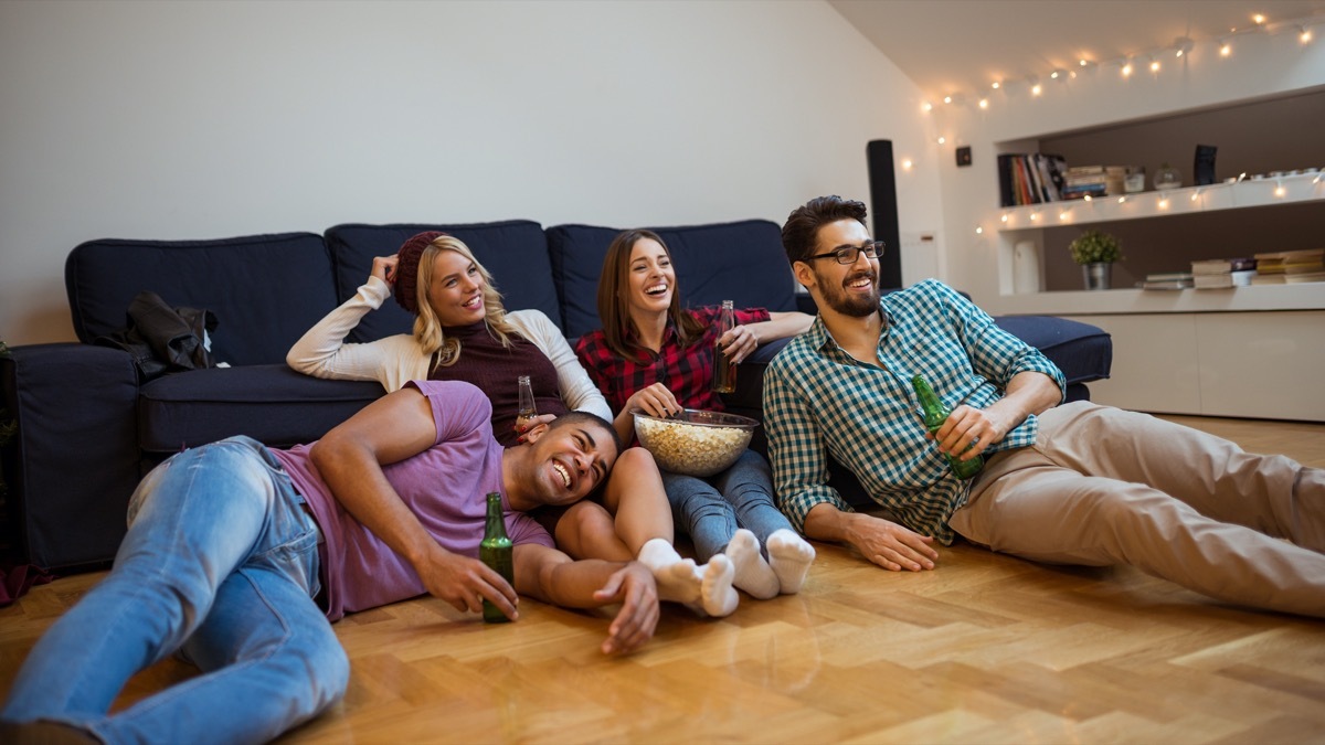 Two couples watching movie at home