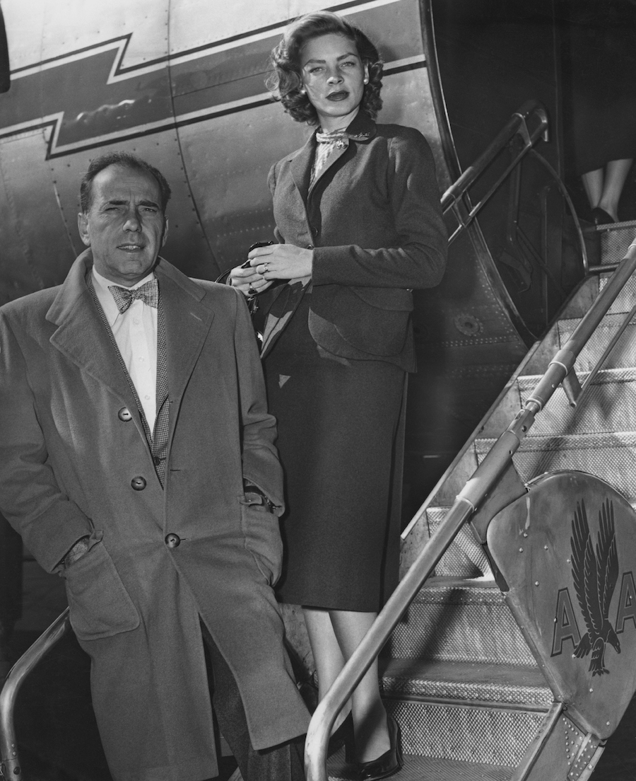 Humphrey Bogart and Lauren Bacall boarding a plane to go to an Adlai Stevenson event in 1952