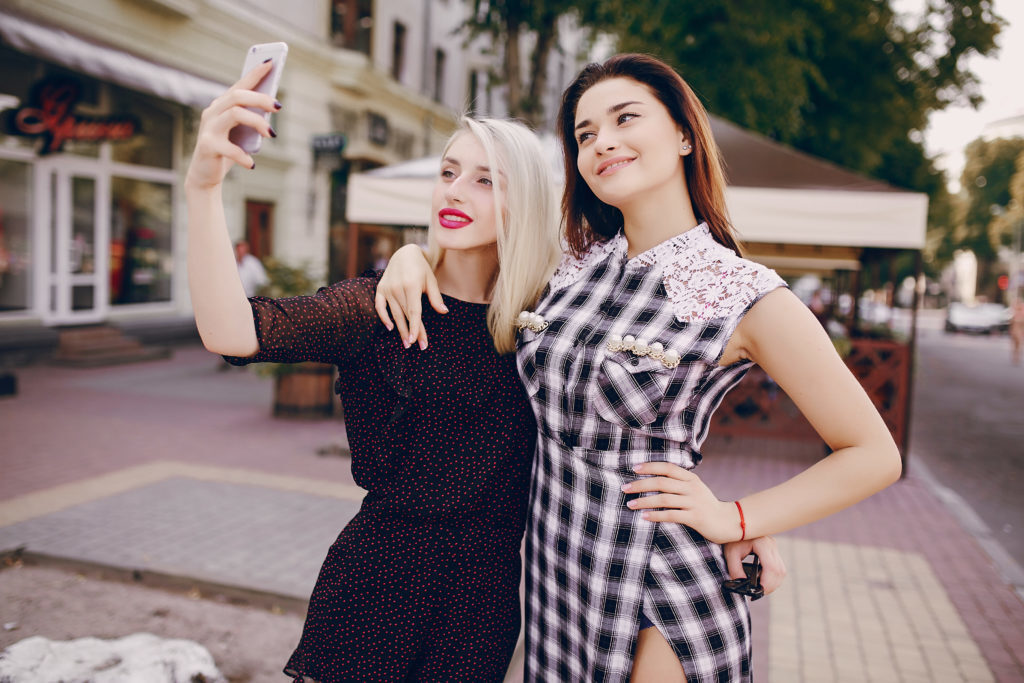 teens taking selfie