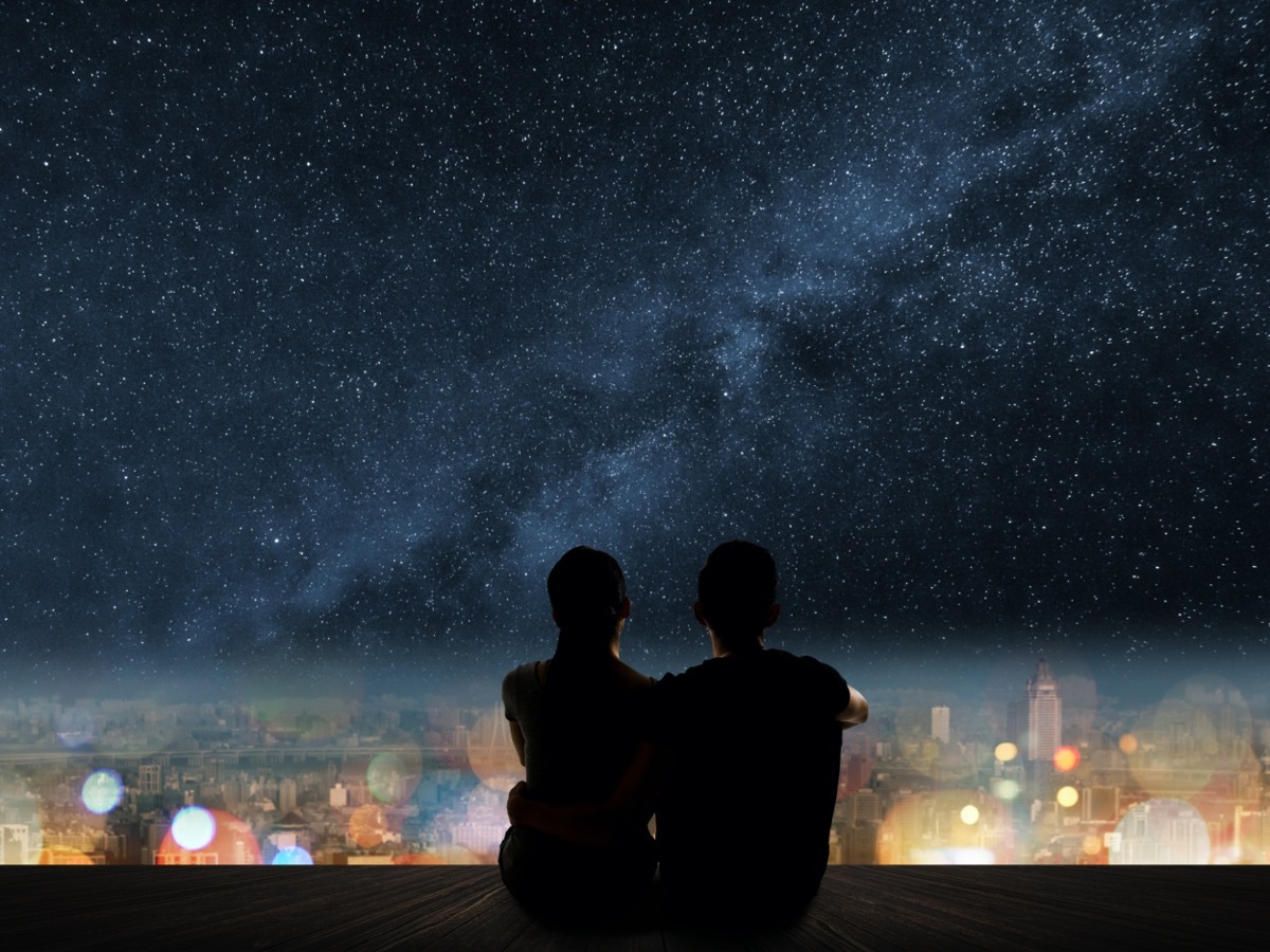 Man and woman looking at starry sky