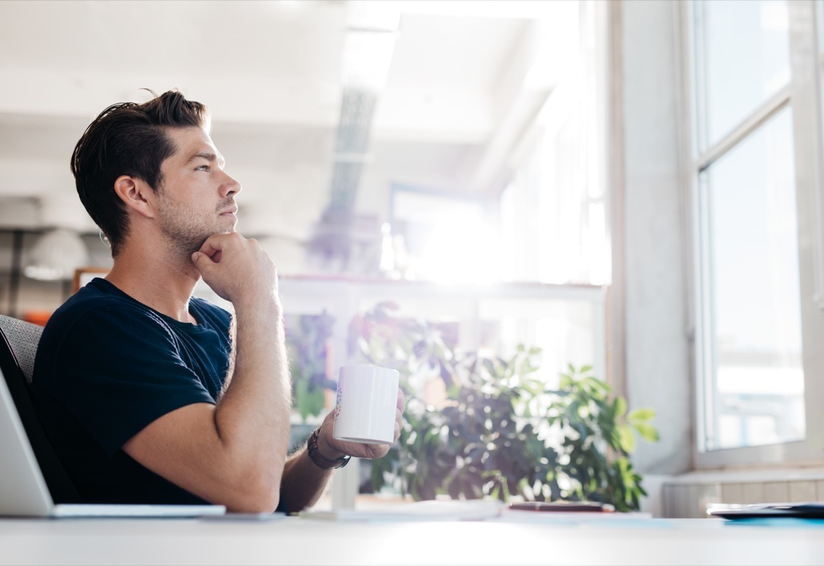 man thinking in chair