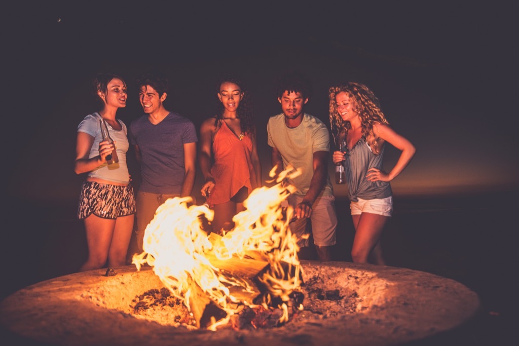 teens at a campfire