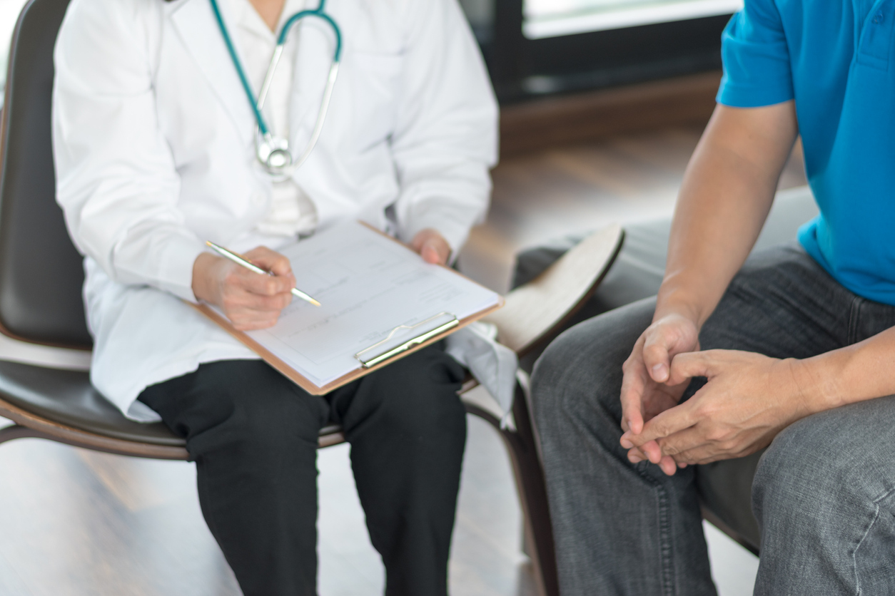 Urologist talking to a patient.