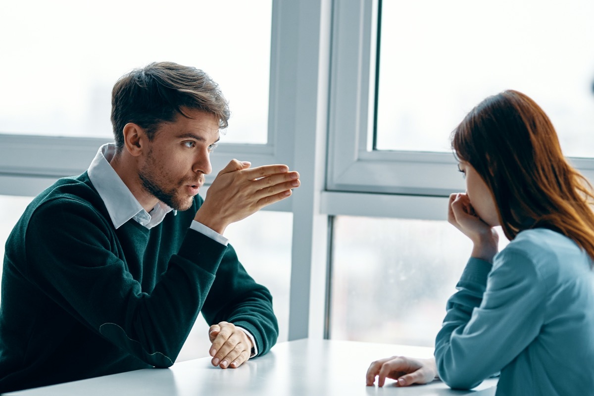 white couple or coworkers arguing