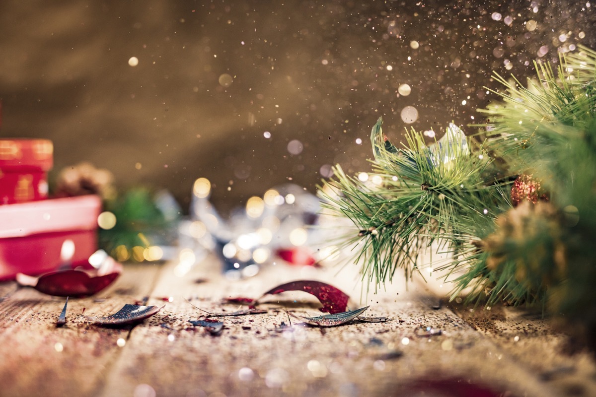 broken ornaments under a christmas tree