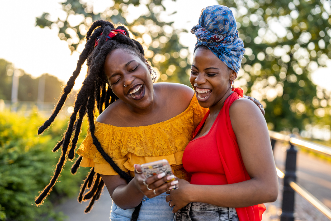 Two female friends laughing together