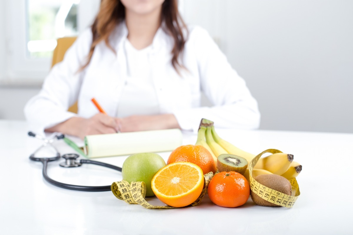 Doctor nutritionist with fruits and vegetable