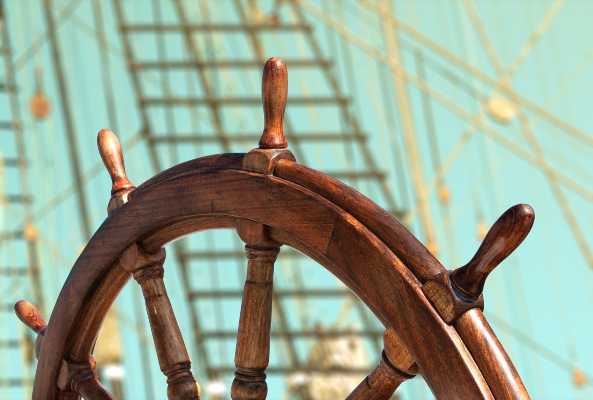 wooden steering wheel on ship