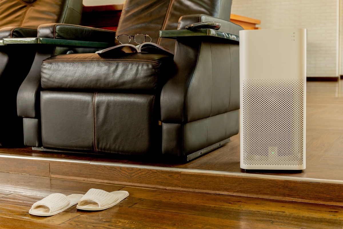 Air purifier next to recliner