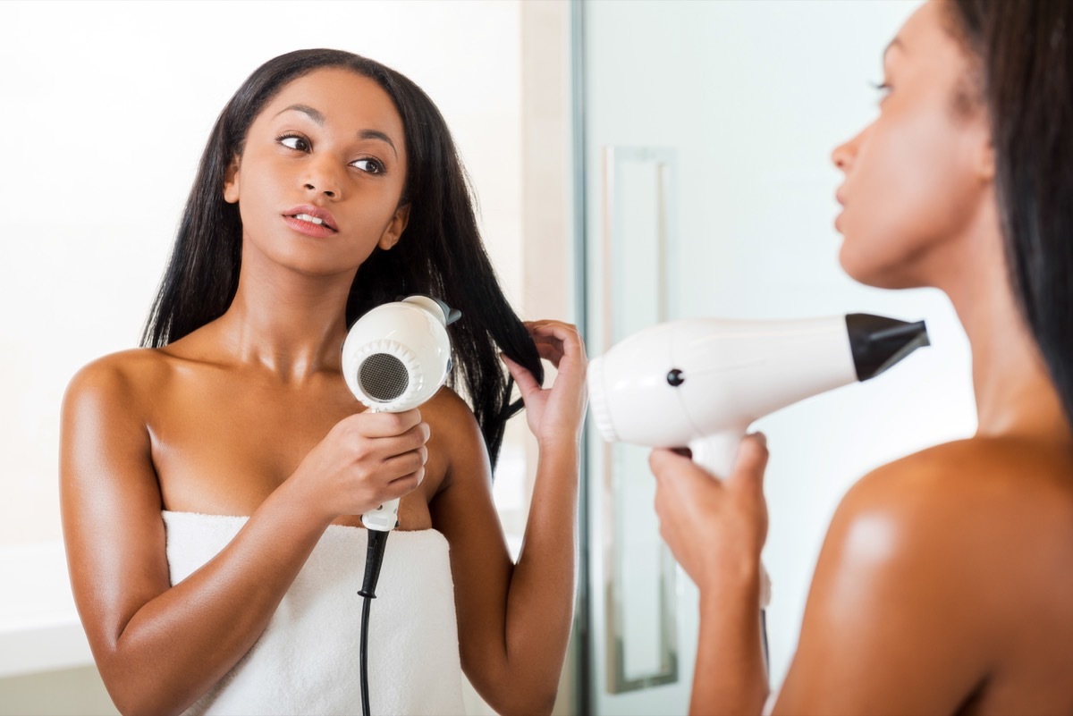 Woman drying hair