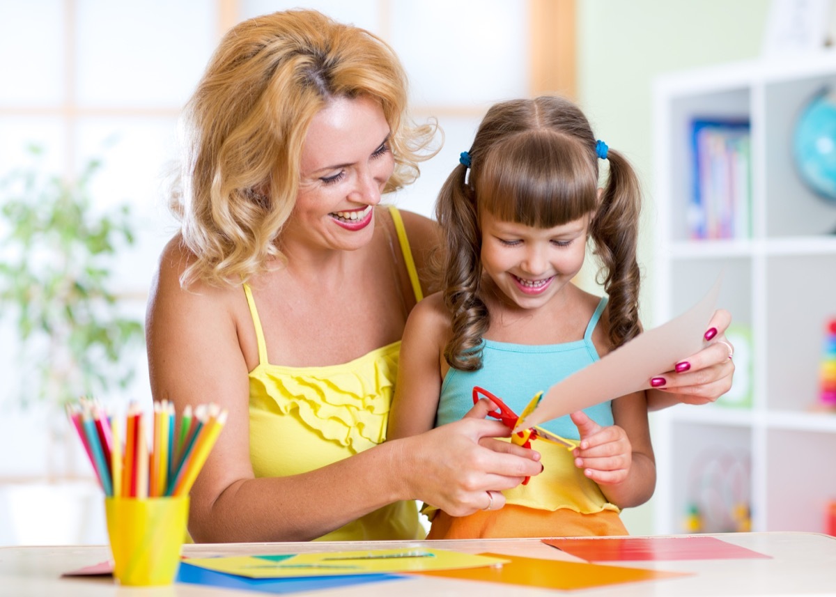 mother doing crafts with her daughter