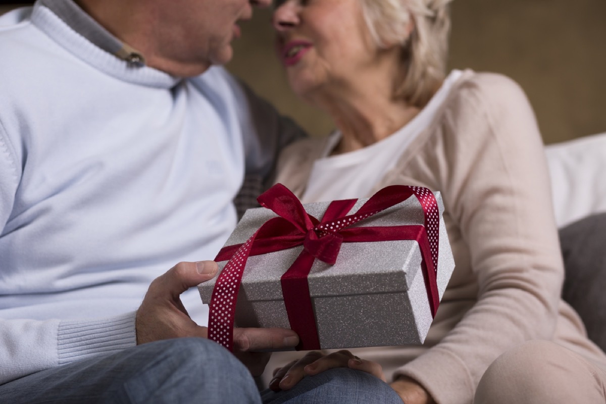 older couple exchanging gifts, relationship white lies