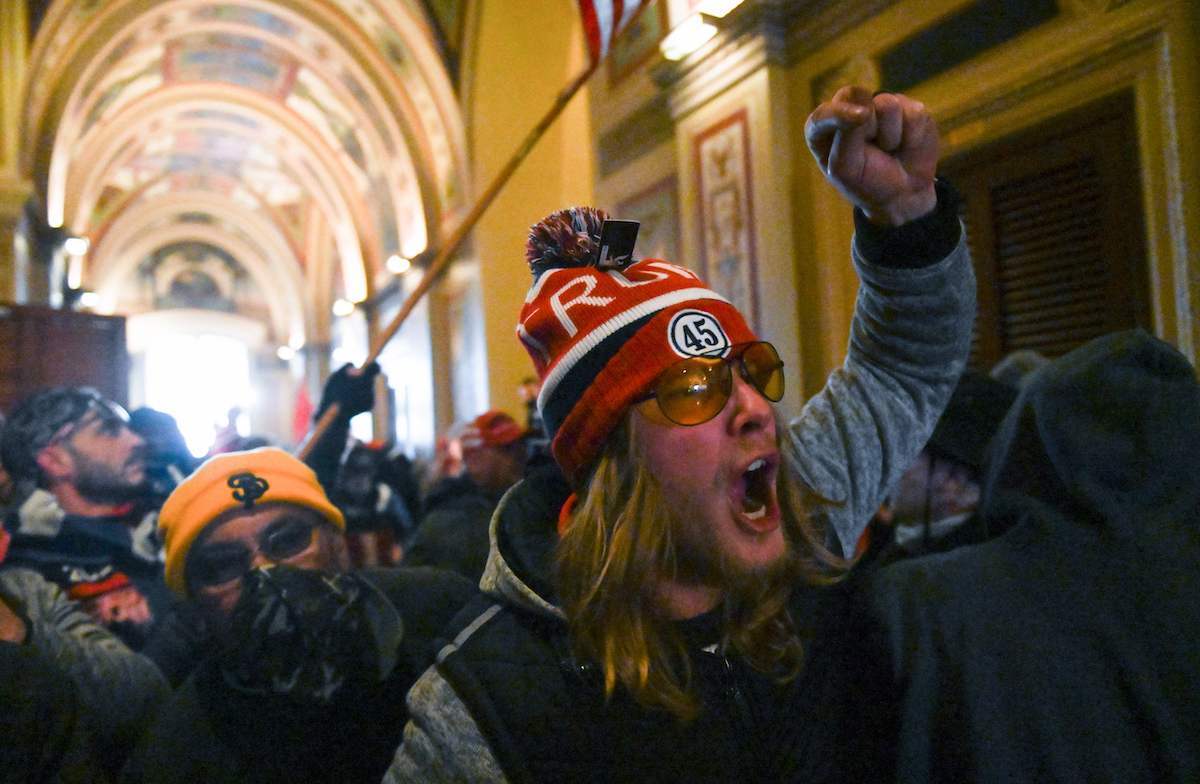 Supporters of US President Donald Trump protest inside the US Capitol on January 6, 2021, in Washington, DC. - Demonstrators breeched security and entered the Capitol as Congress debated the a 2020 presidential election Electoral Vote Certification.