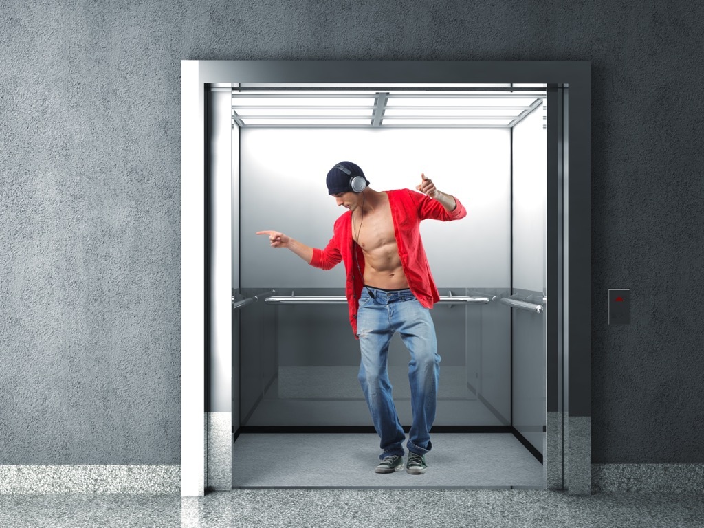 elevator etiquette man on phone