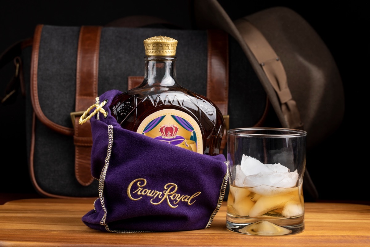 Crown Royal in a bag next to a glass of ice