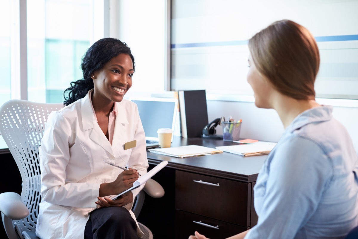 young woman talking to her doctor