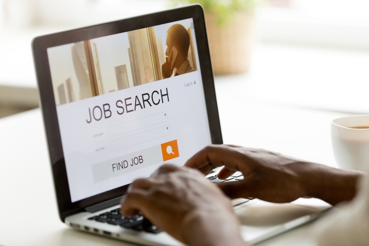 man using laptop to search for jobs