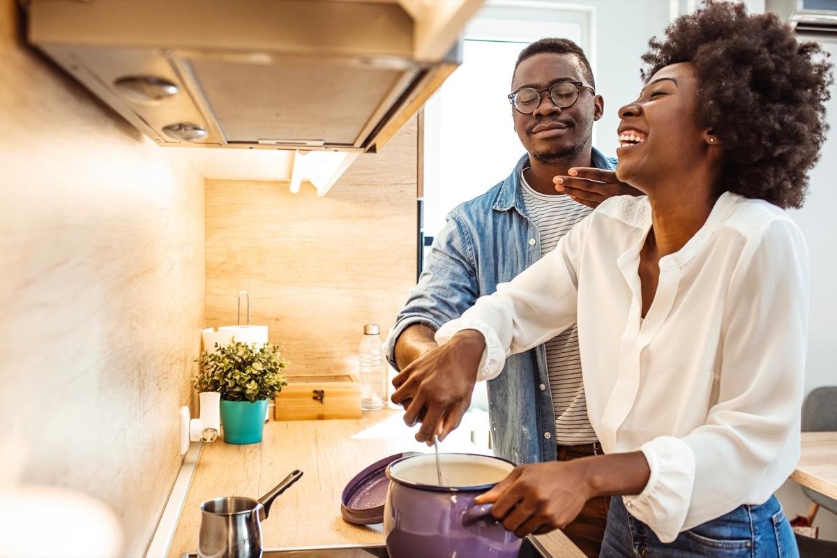 Couple Cooking together in Kitchen