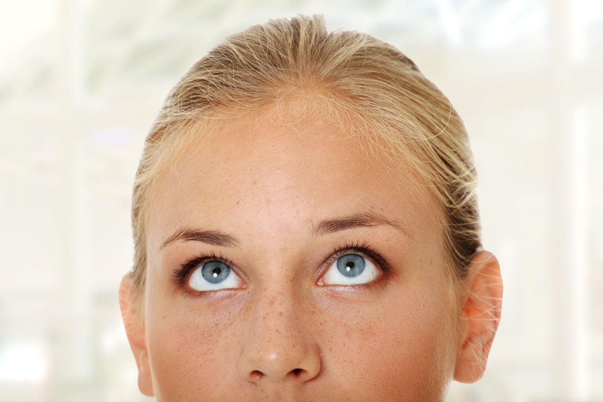 Woman looking up with eyes