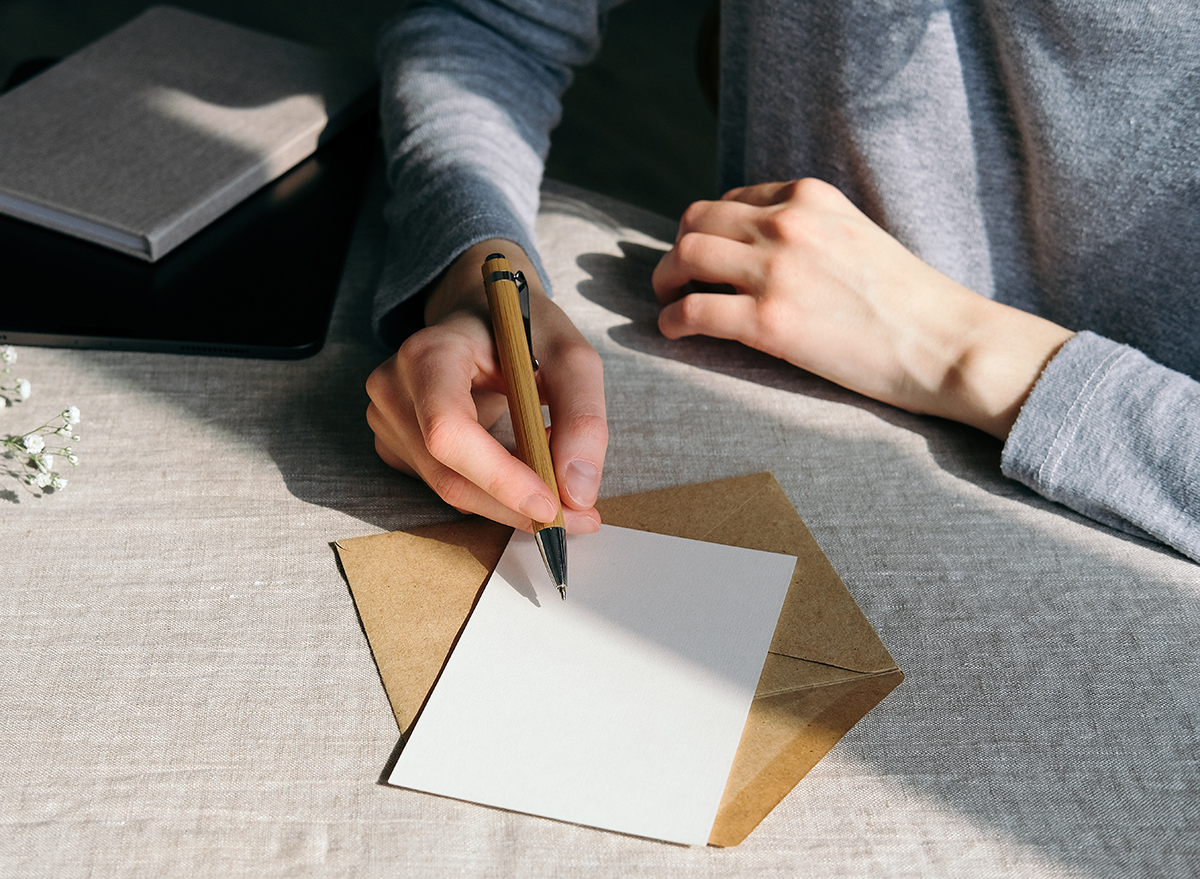 Closeup person writing letter