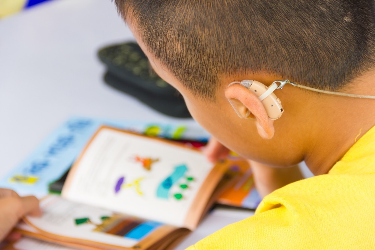 Back of child's head shows hearing ad, deaf children Prince Philip controversial moments