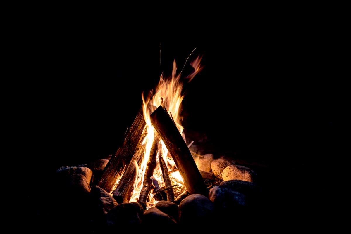 camp fire burning at night