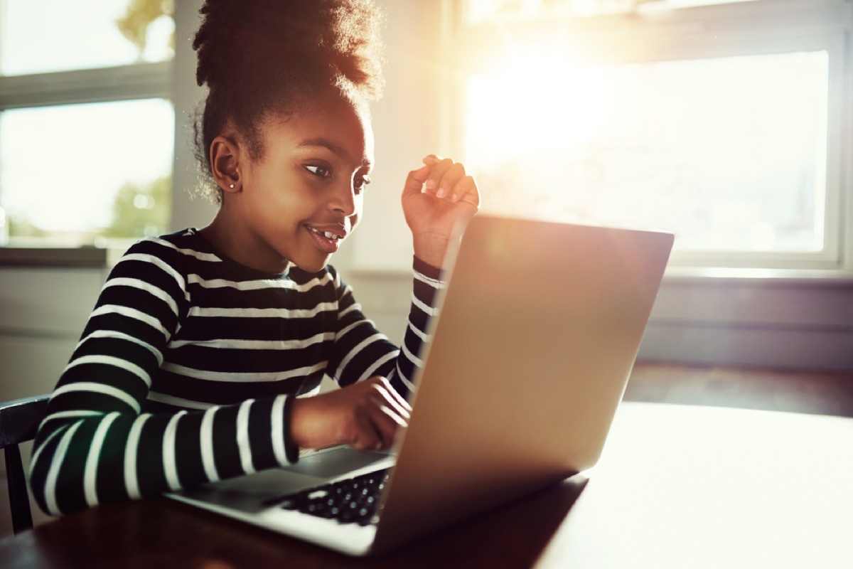 girl using laptop, skills parents should teach kids