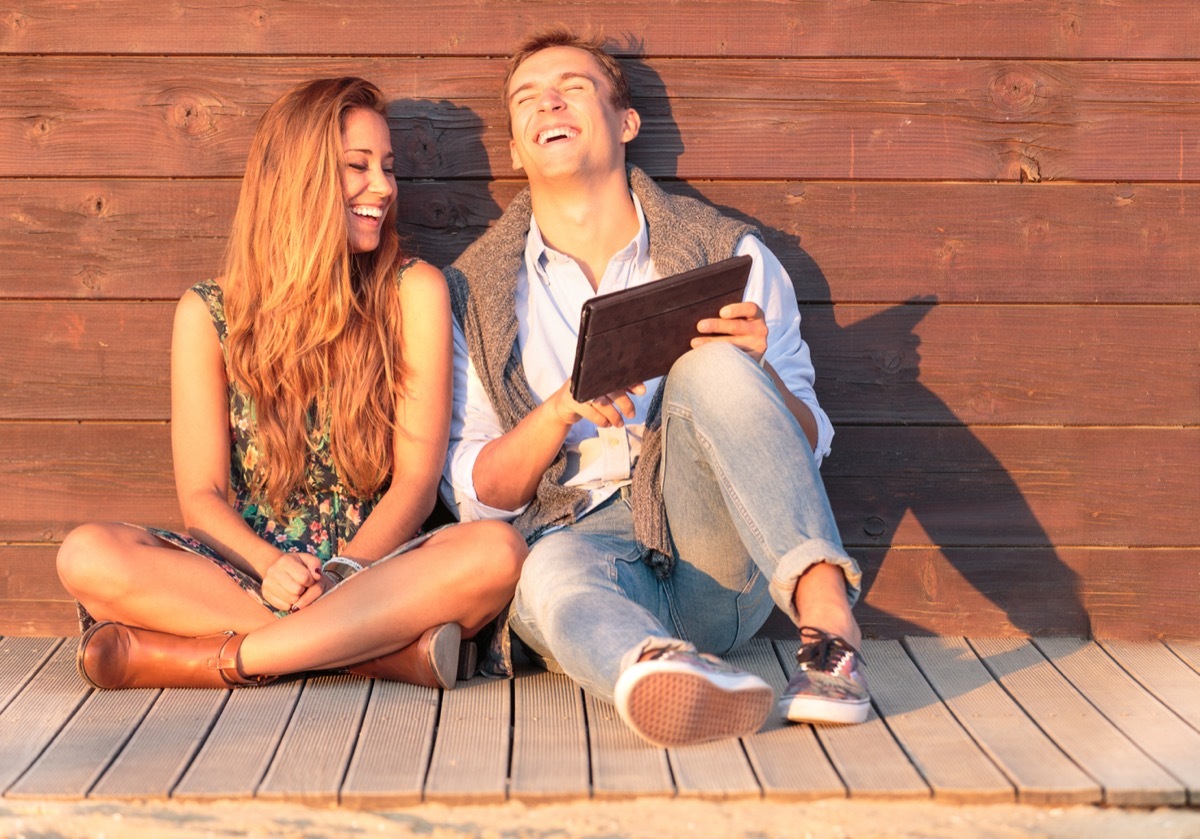 Two People Laughing Outside in the Sun