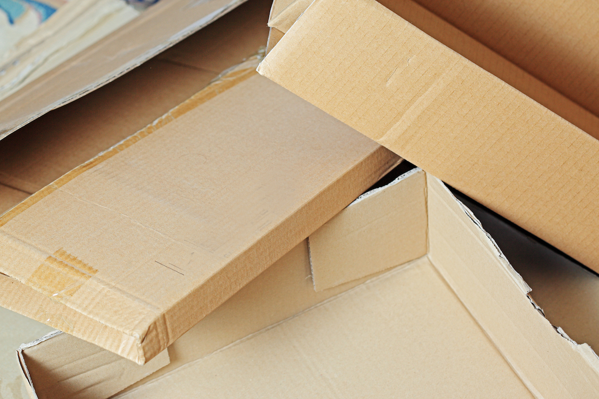 Close up of a pile of crushed cardboard boxes.