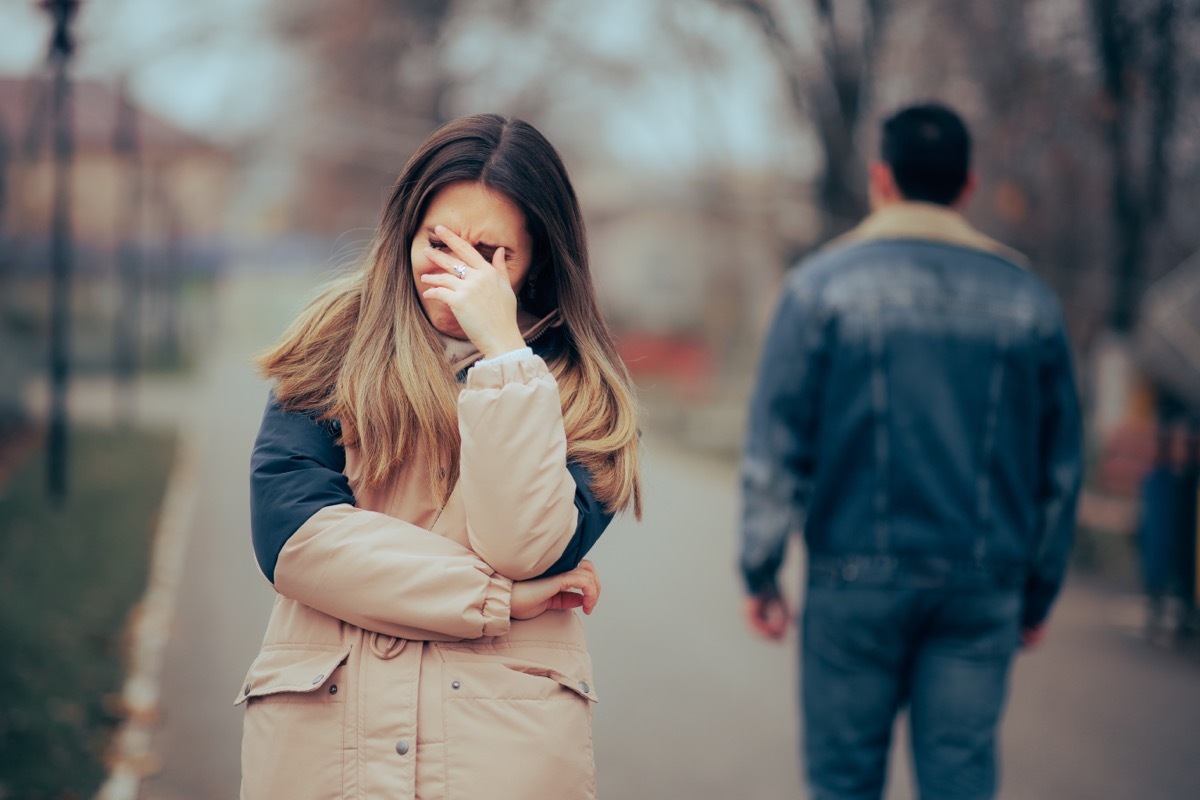 woman upset man walking away