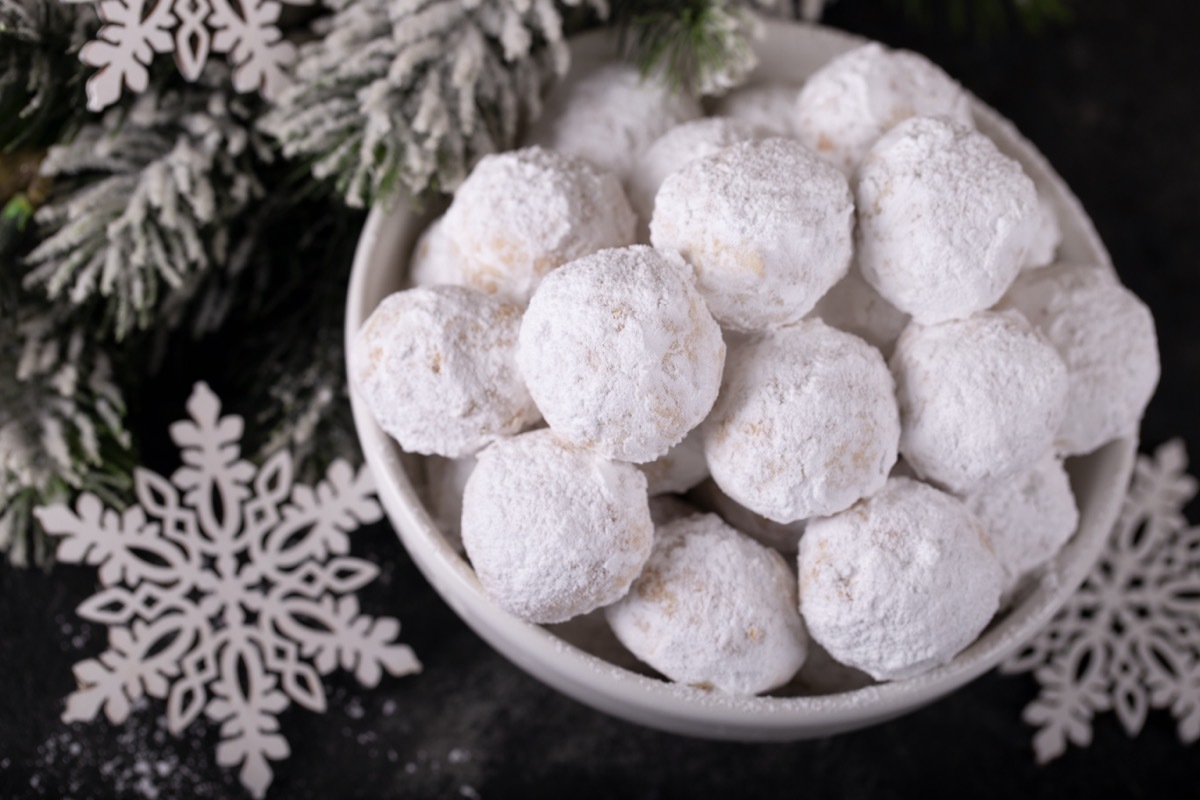 snowball cookies in white bowl on table