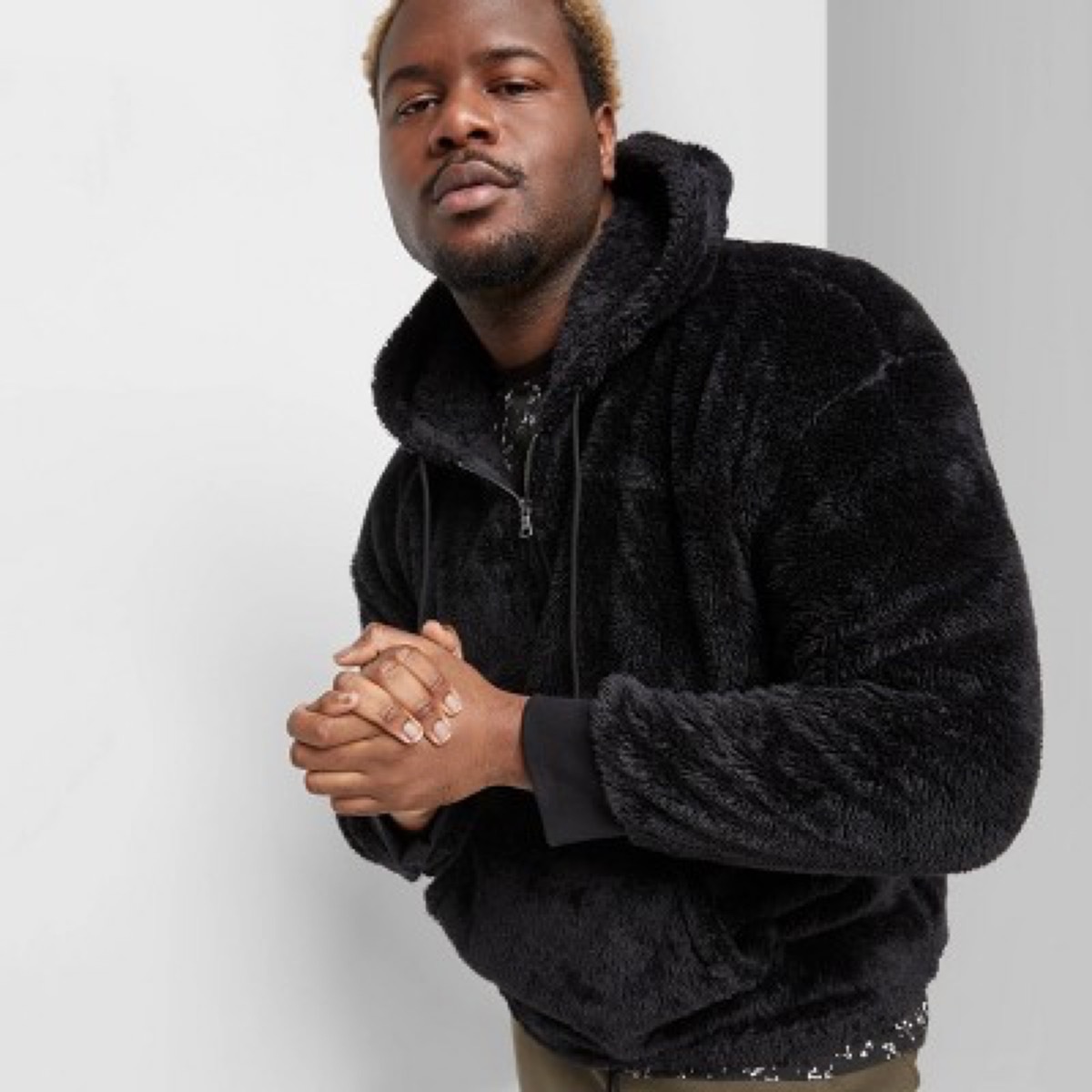 young black man in furry jacket