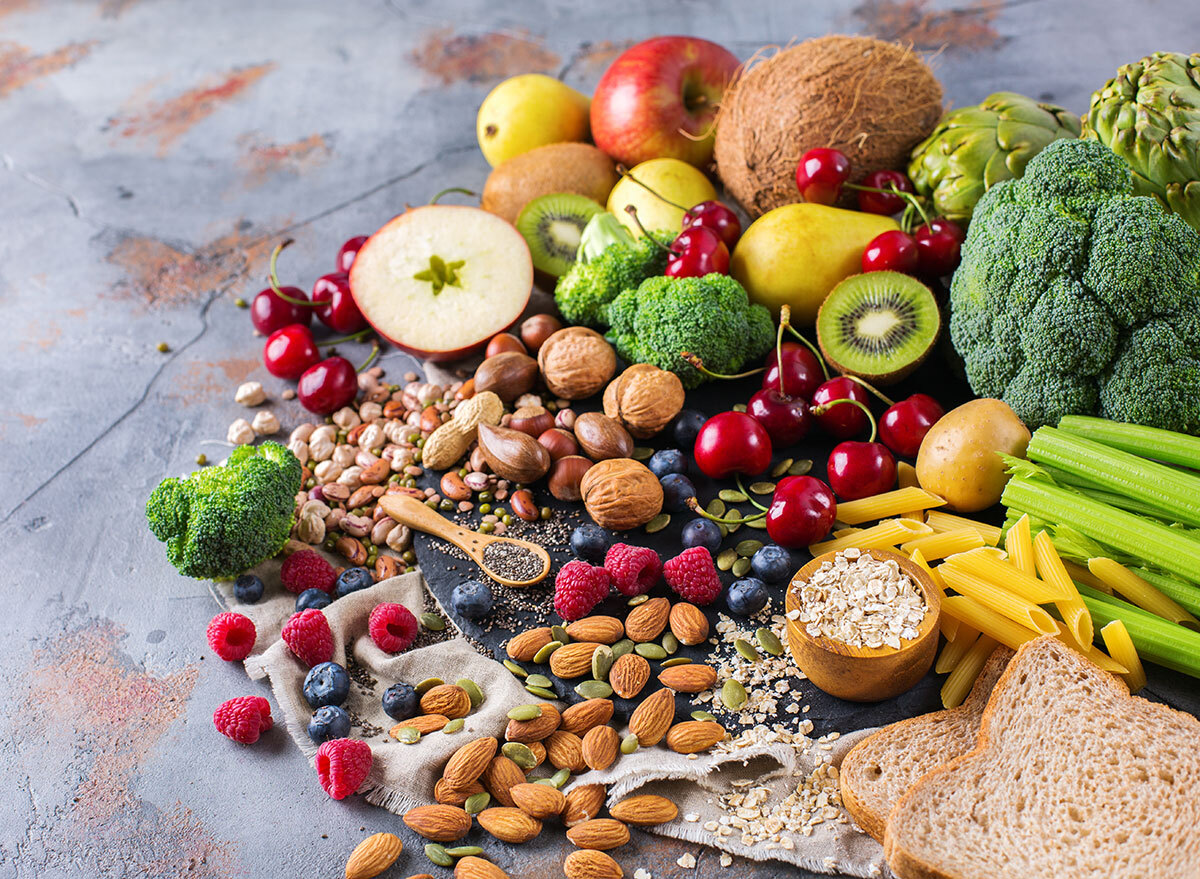 a spread of various vegetables, fruits, nuts and oats