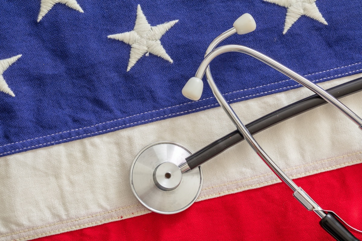 Medical stethoscope on a US of America flag, top view