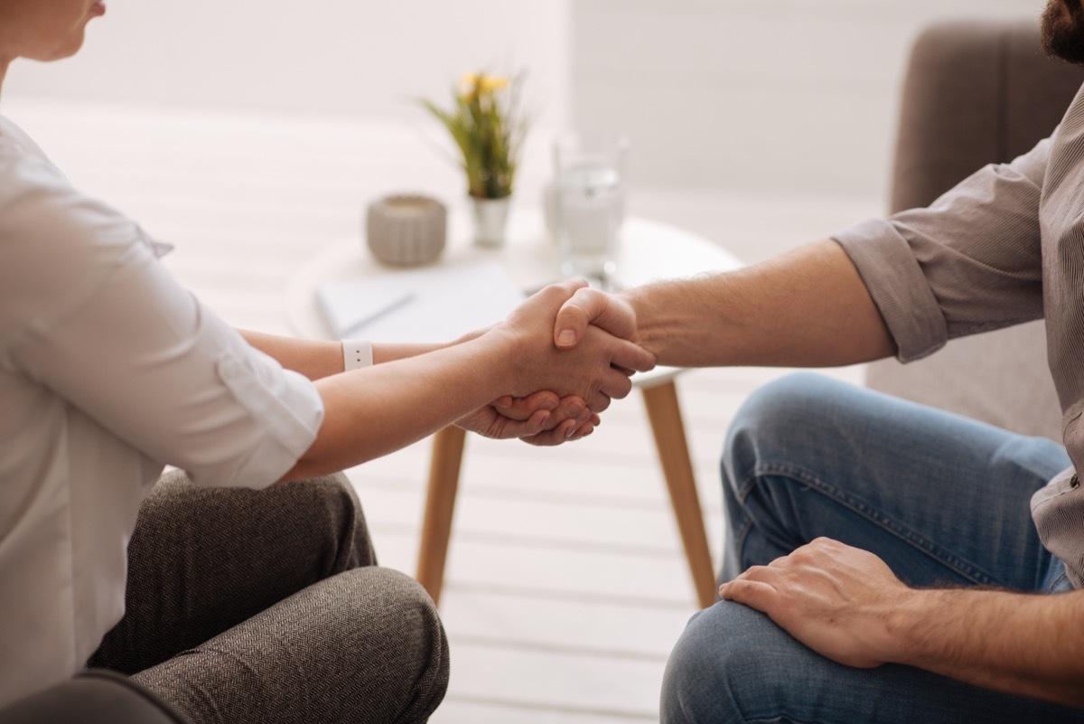 Greeting each other. Close up of a handshake of two people while greeting each other