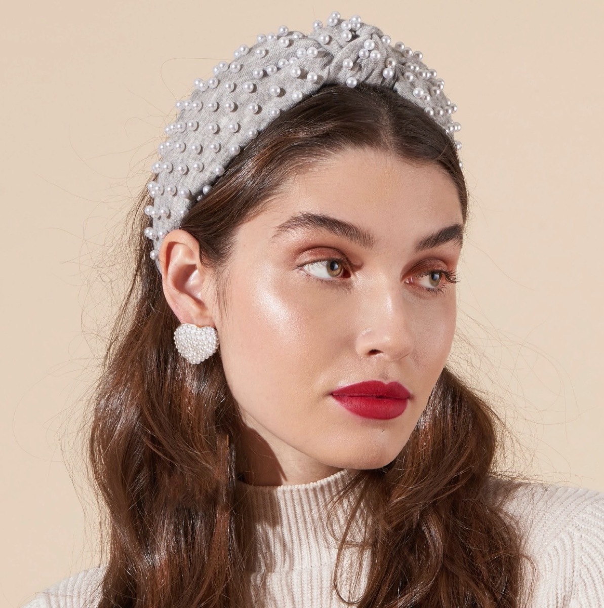 woman wearing gray headband with pearls