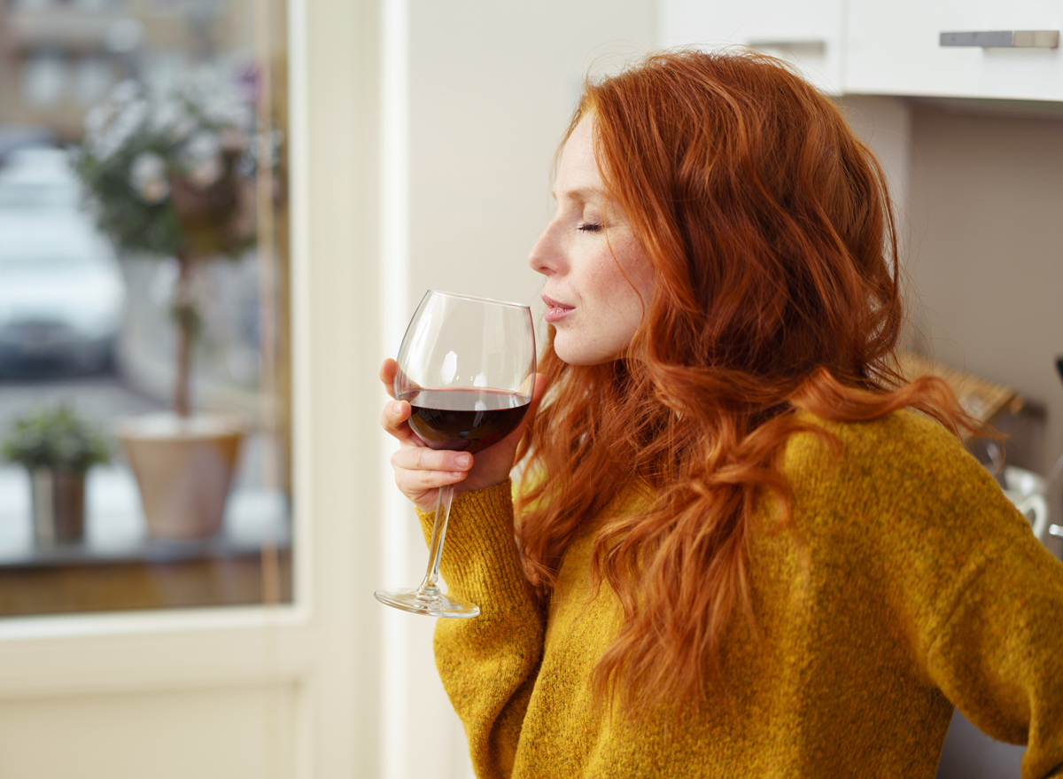 woman drinking wine alcohol at home