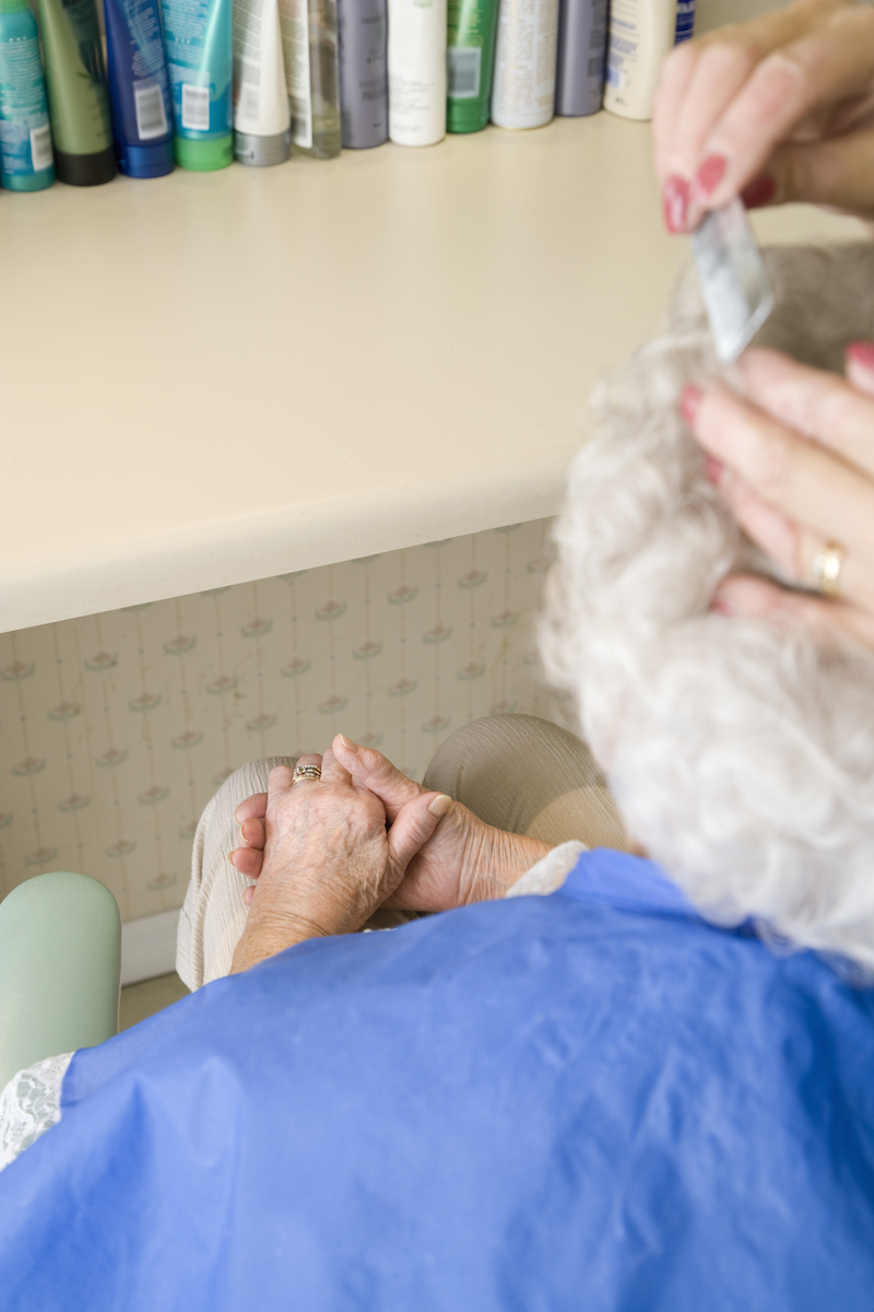 Senior woman receiving beauty treatment